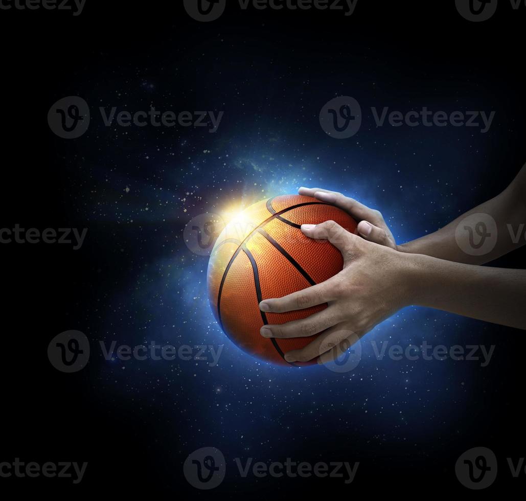 basketball ball in man's hand. basketball game concept photo