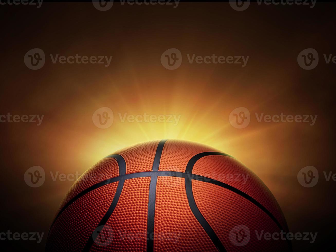 basketball ball. on black background with smoke, yellow orange red white colored back lights photo