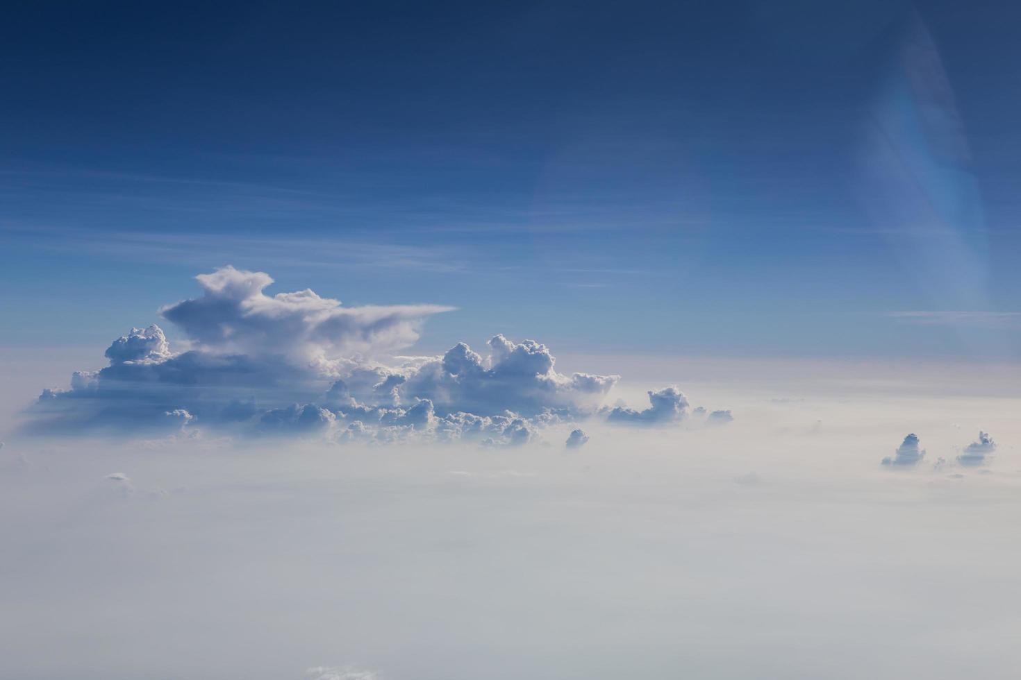 clouds and blue sky seen from plane photo