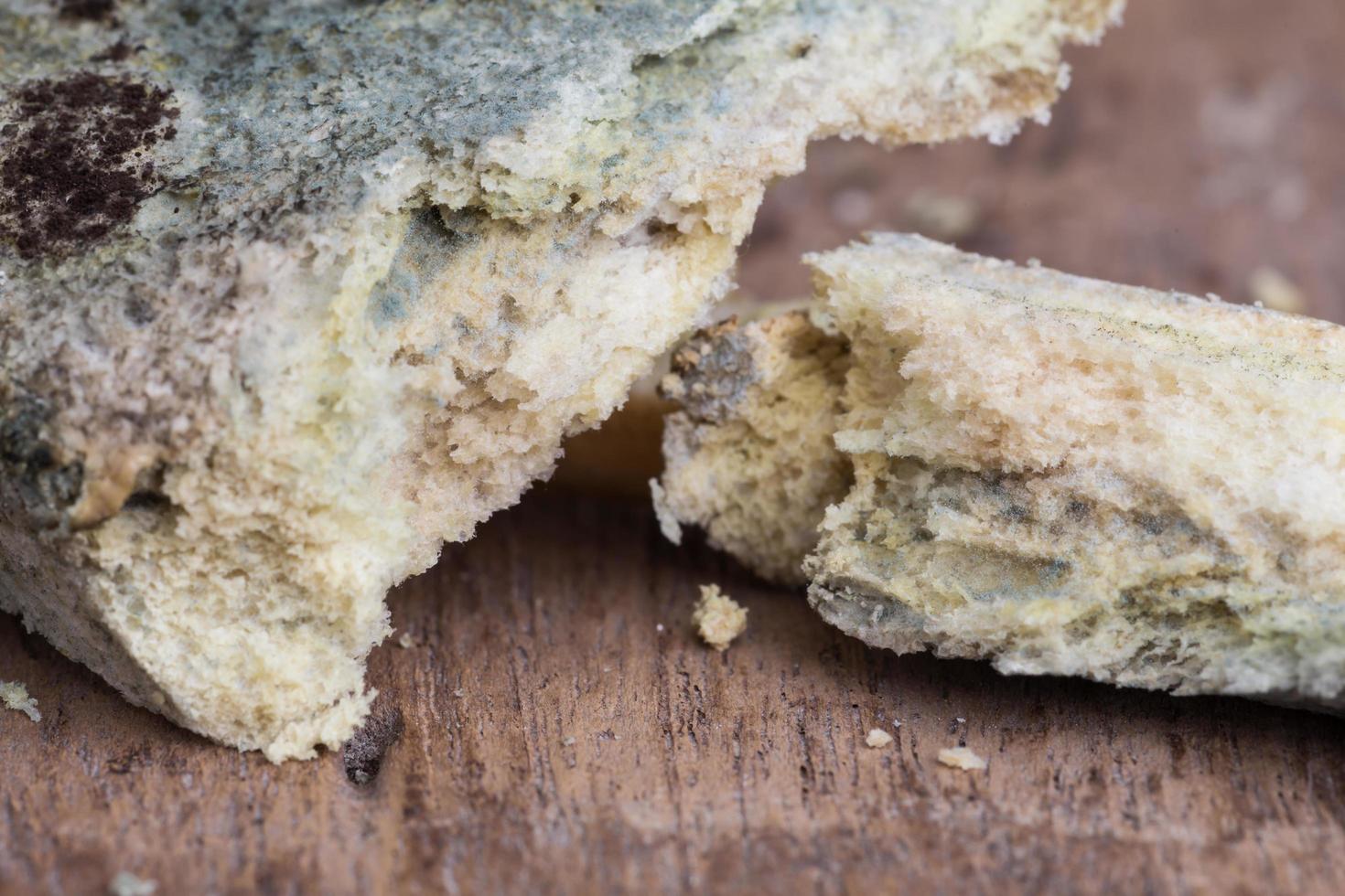 Mouldy bread on cutting board photo