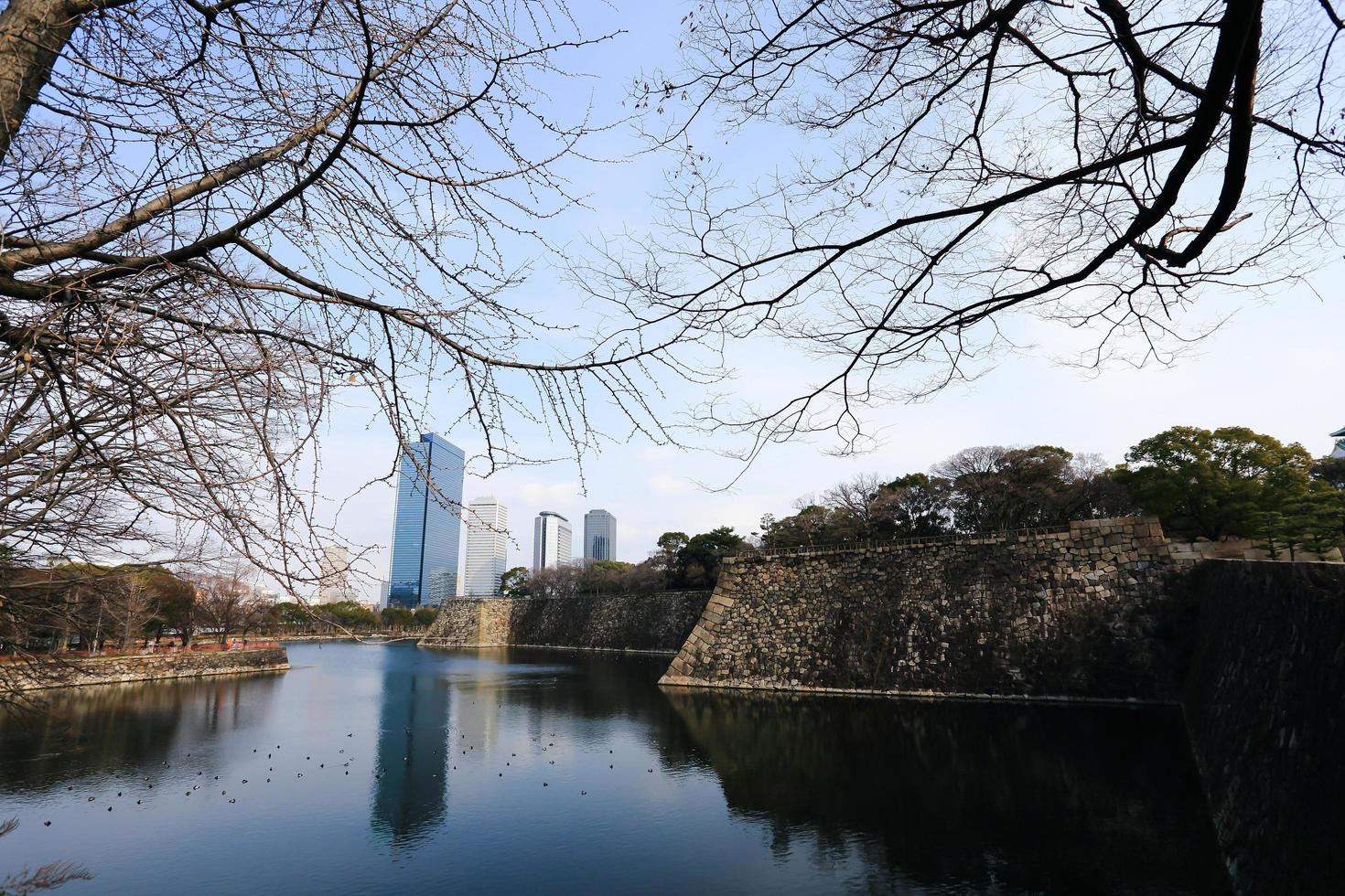 A moat surrounding Osaka castle in Japan, winter photo