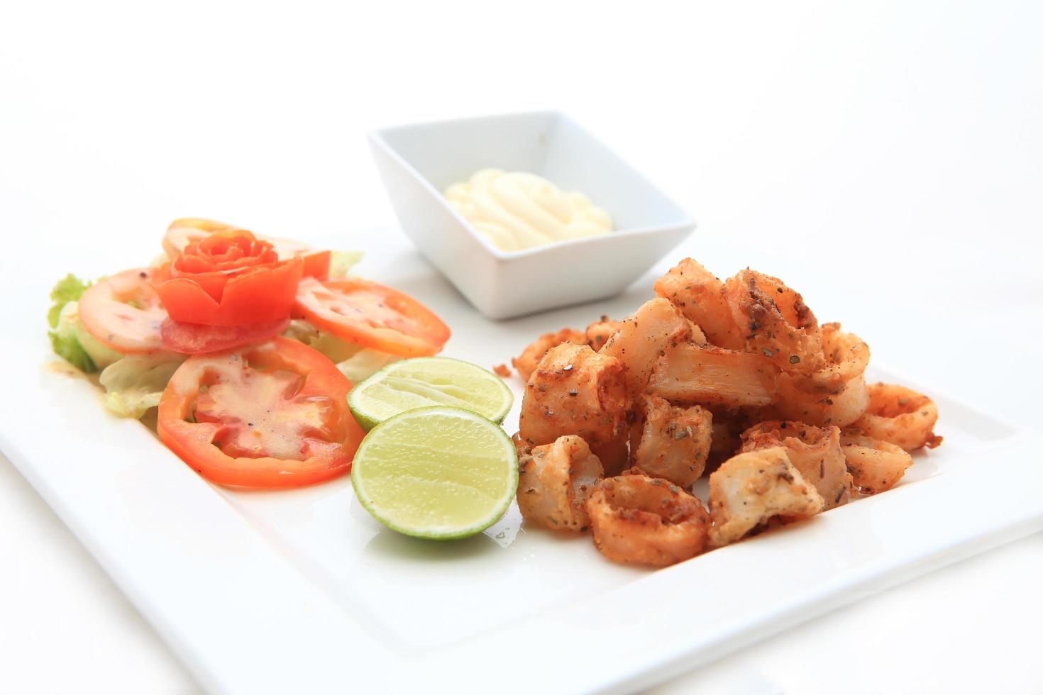 fried calamari, fried squid with lemon photo