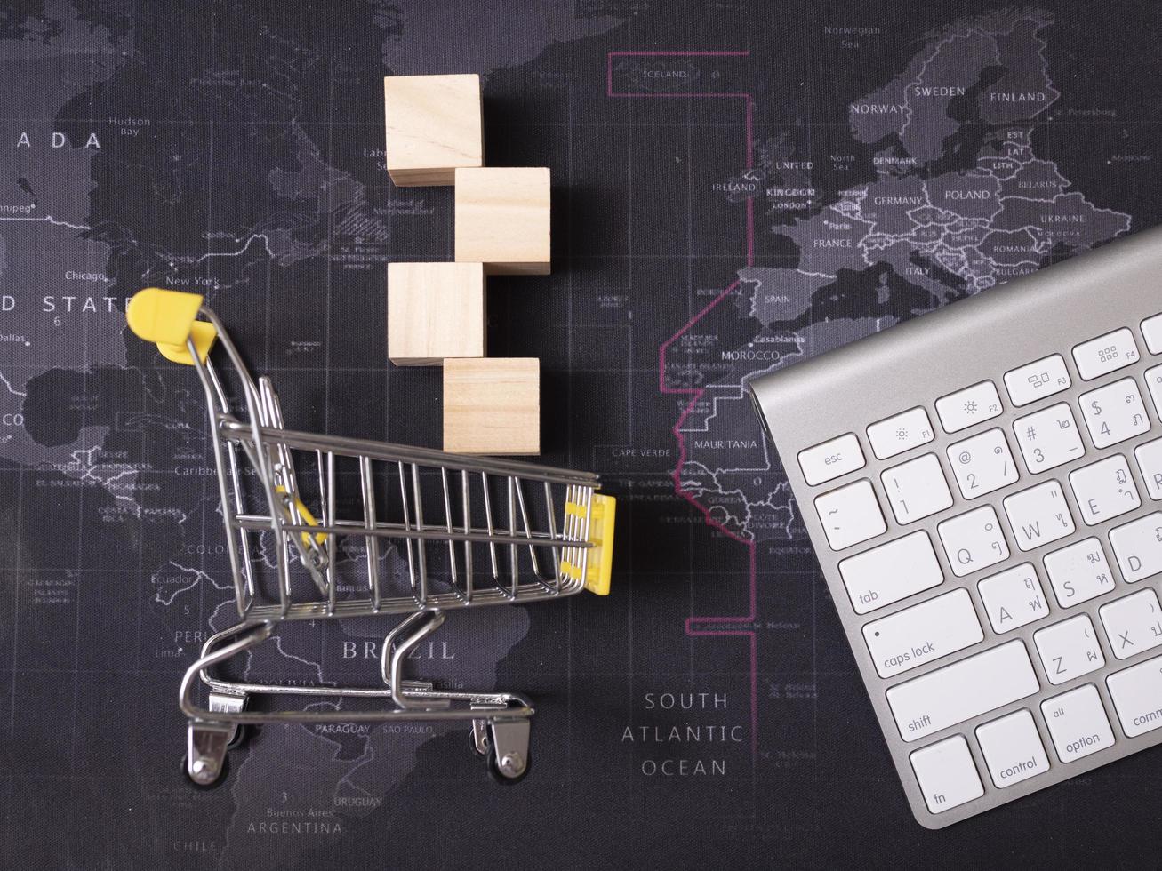 White wooden cube and white basket on the black map photo