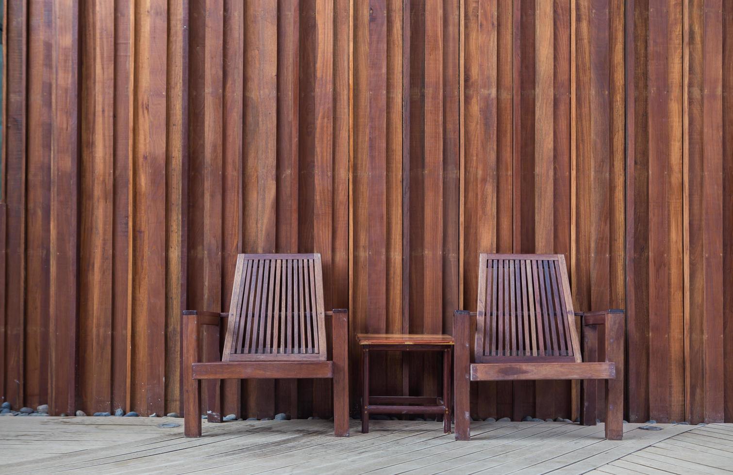 wooden chair on the  in front of the wall wood photo