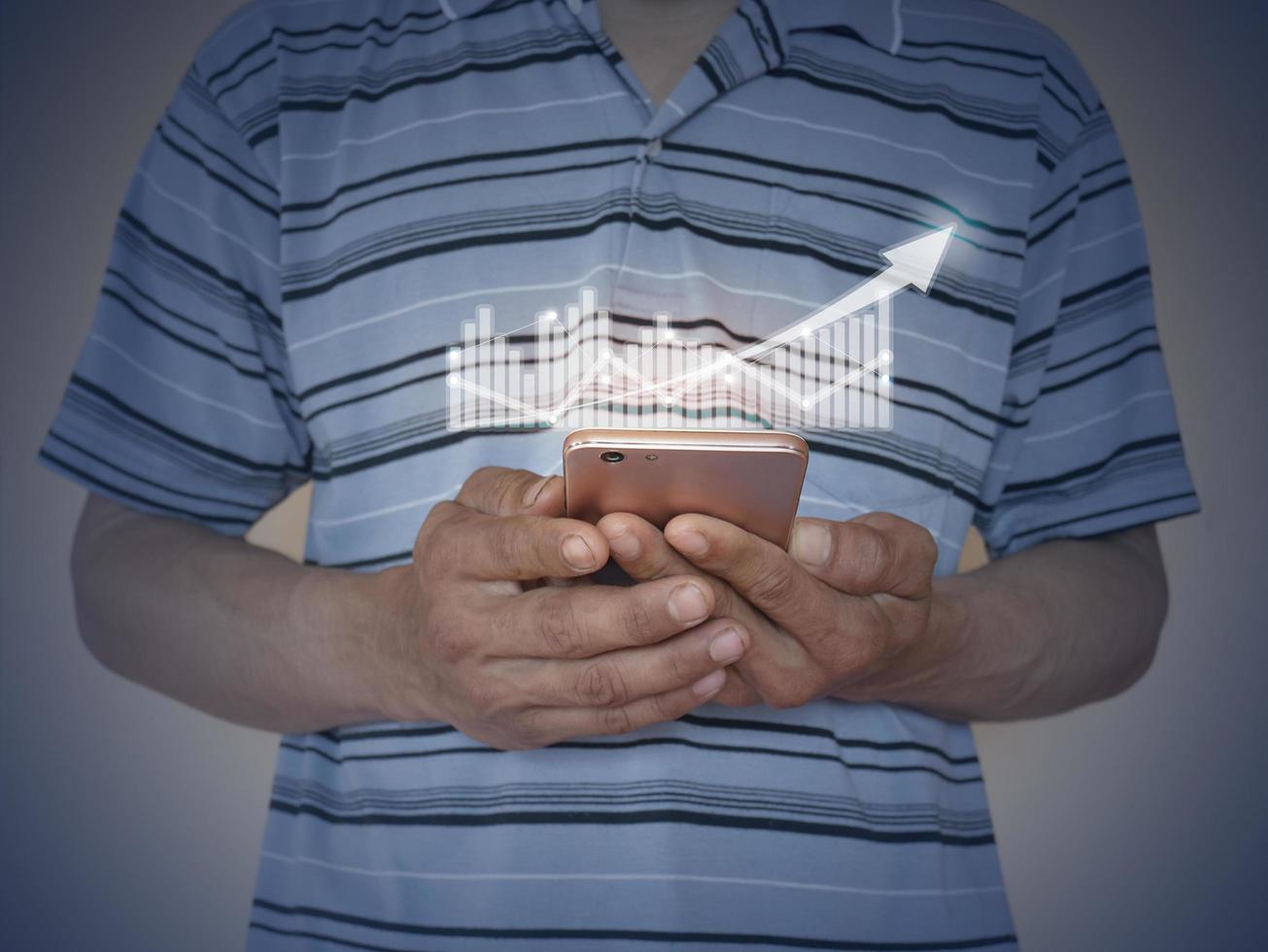 Businessman using mobile phone in a standing position to digital network connection for development of business. Technology and digital marketing. Financial and banking by technology smartphone. photo