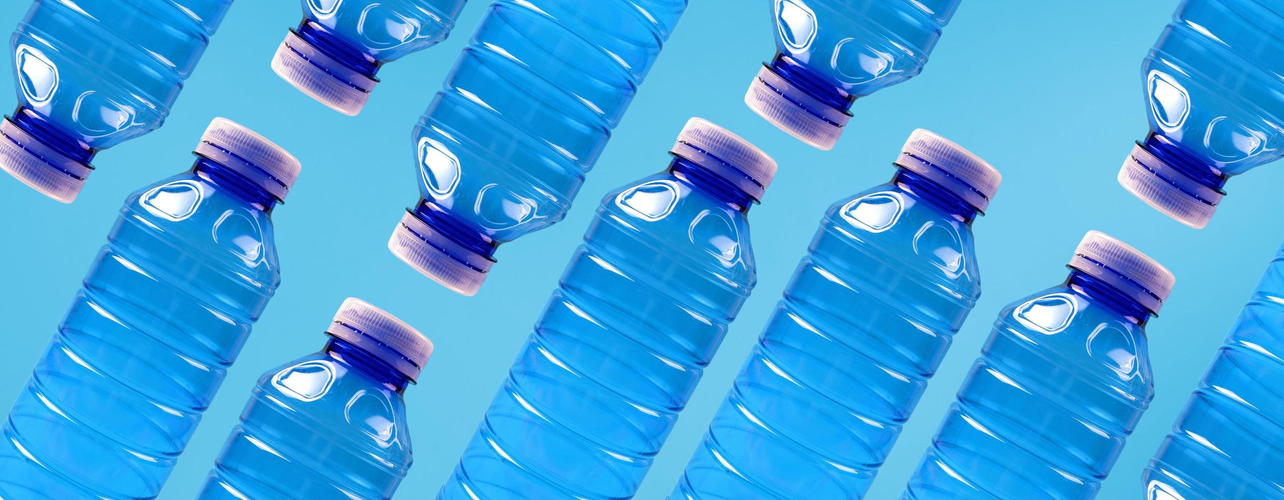 Eco banner. Concept of environmental protection and segregation of plastic waste. Plastic bottles on a blue background. photo