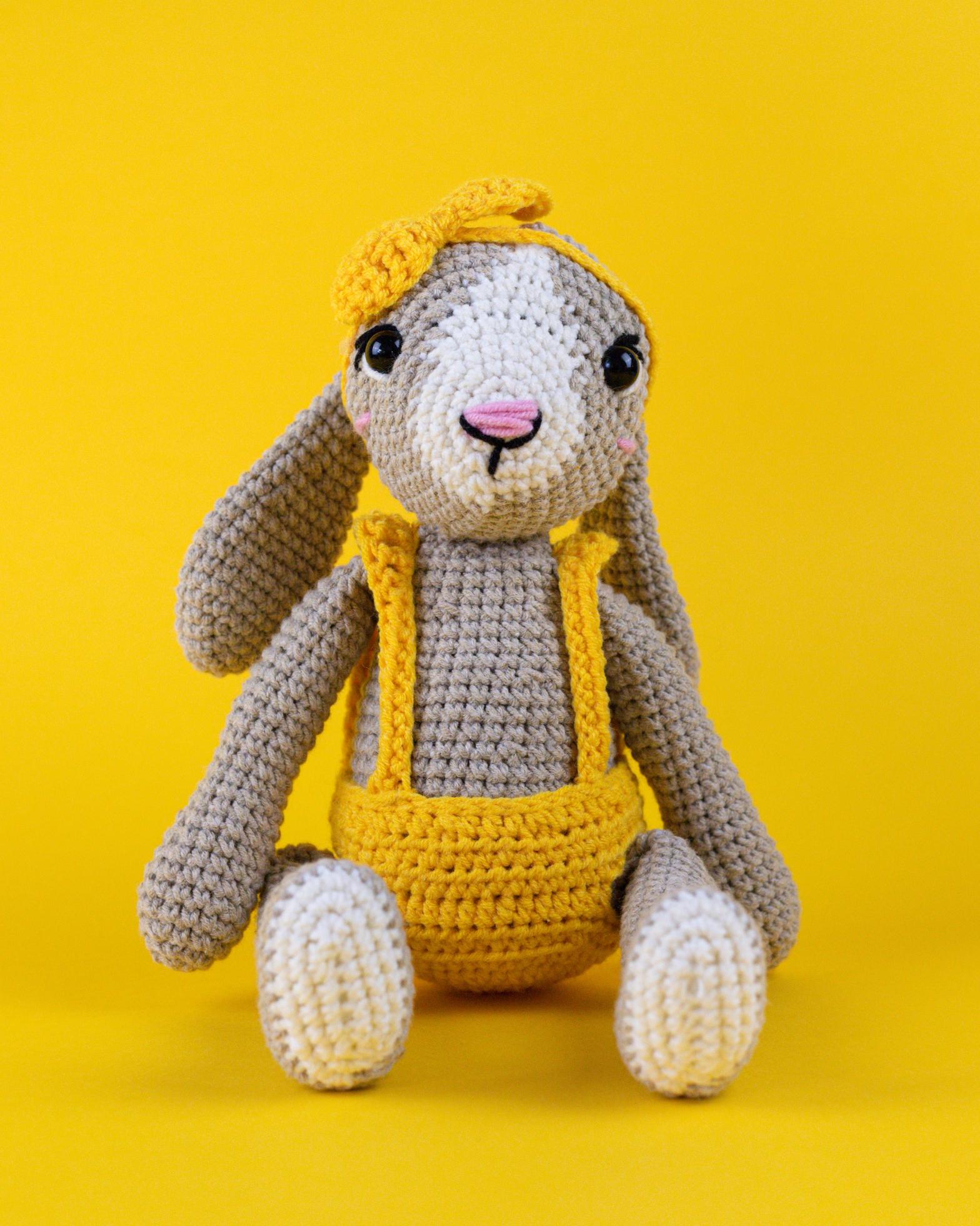 Knitted rabbit, handmade toy. 9638803 Stock Photo at Vecteezy