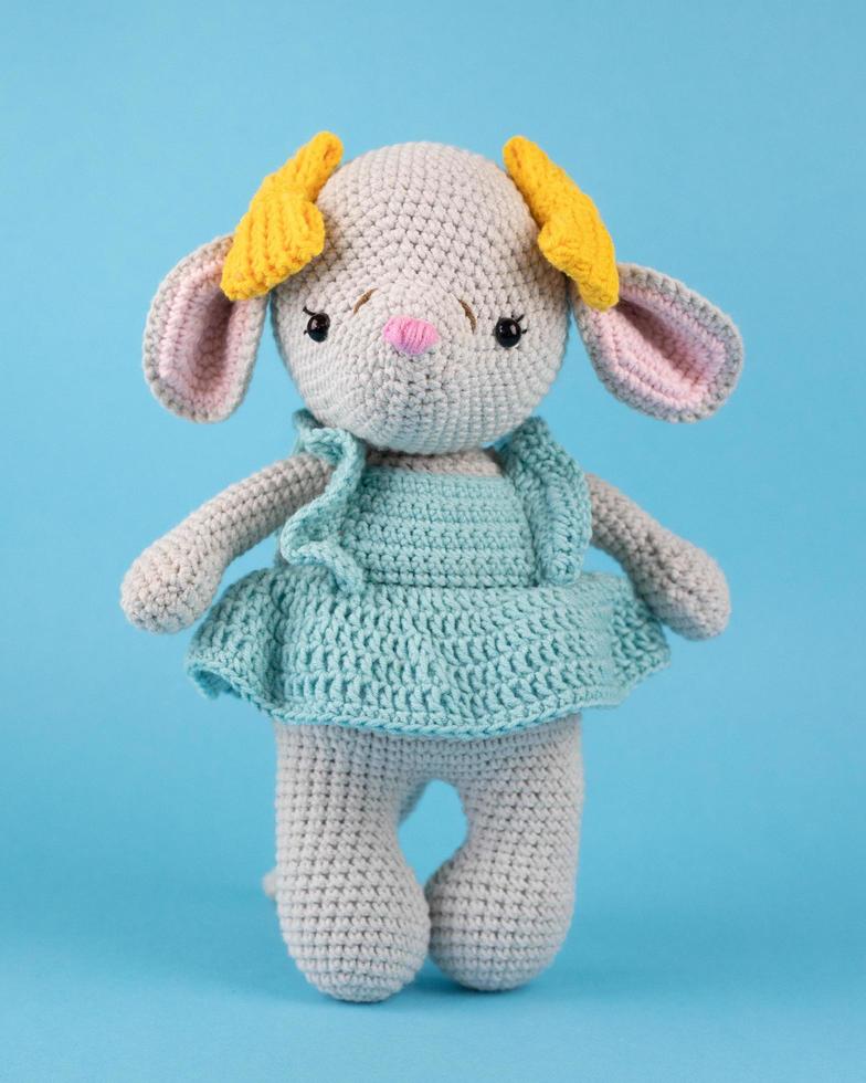 A knitted mouse, a handmade toy. photo