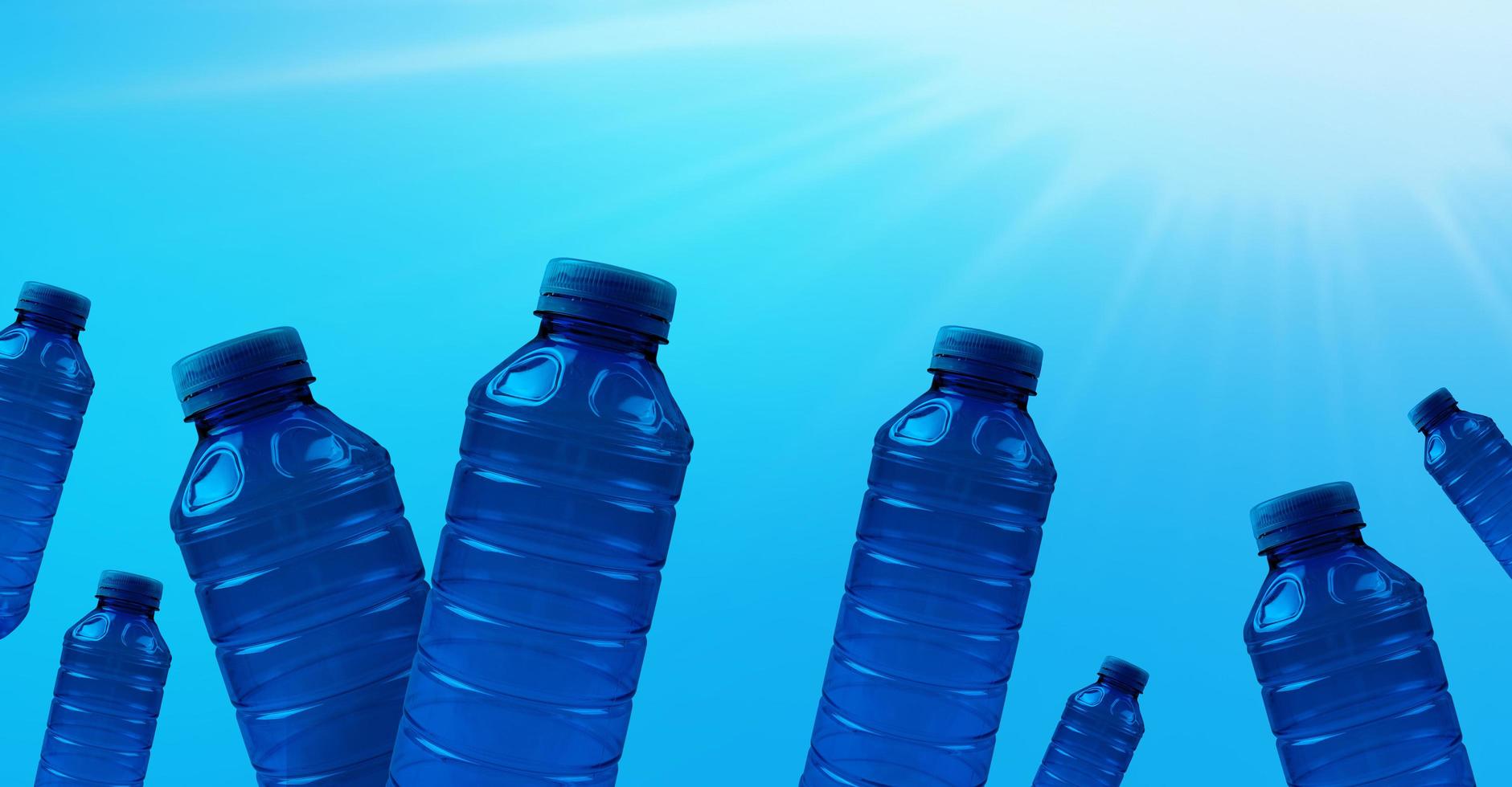 Plastic bottles on a blue background. Concept of eco banner and earth cleanliness. photo