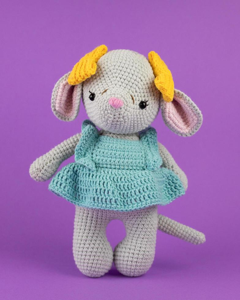 A knitted mouse, a handmade toy. photo