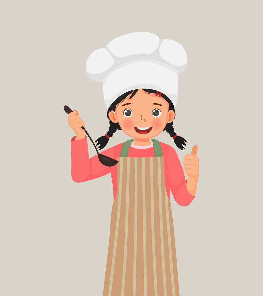 linda niñita con sombrero de chef y delantal sosteniendo una cuchara de sopa de cucharón mostrando el pulgar hacia arriba vector