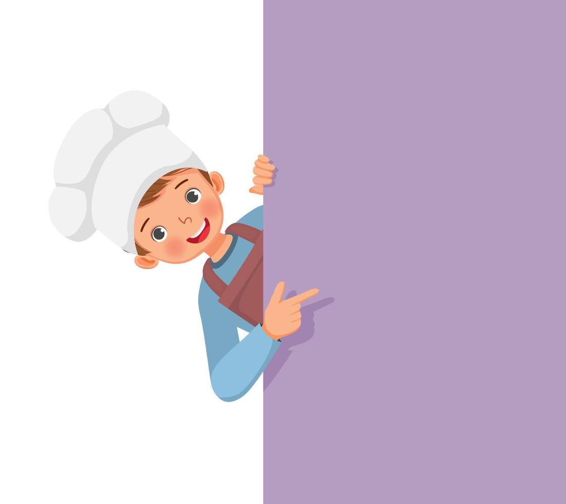 cute little boy in chef hat and apron peeking from board pointing finger to empty banner for copy space vector