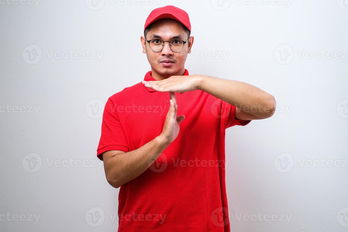 Asian delivery man doing time out gesture with hands photo