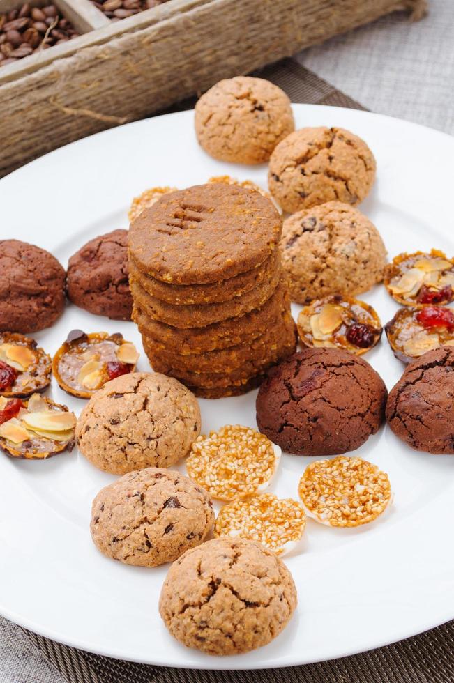 many different types of cookies lay on a plate photo