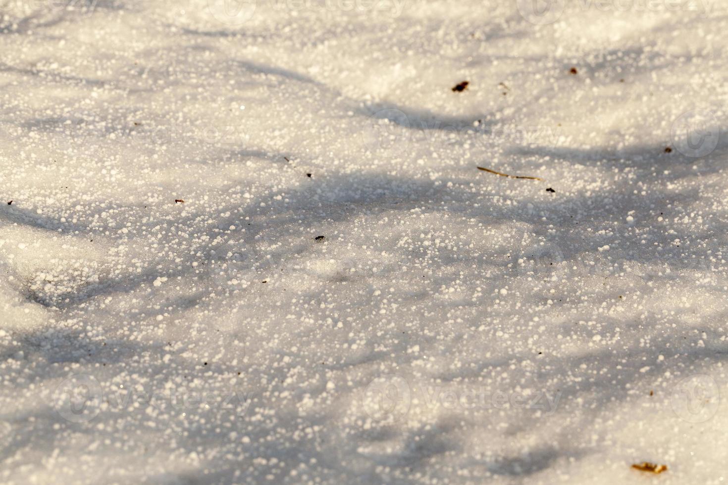 Snow drifts dirt. photo