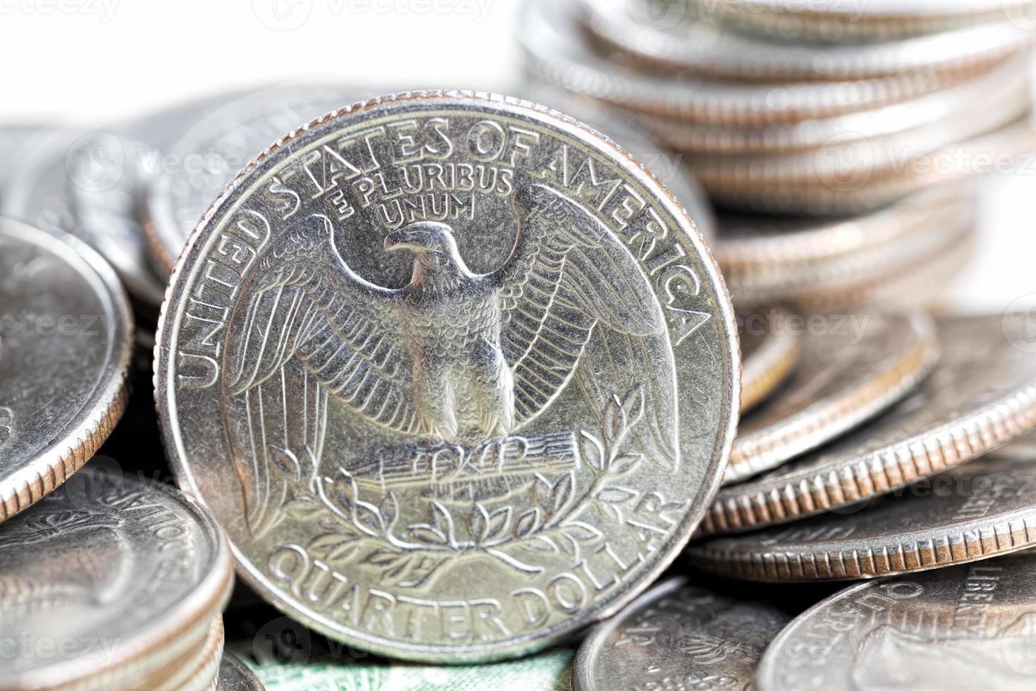 a stack of American twenty five cent coins, a close up of American coins photo