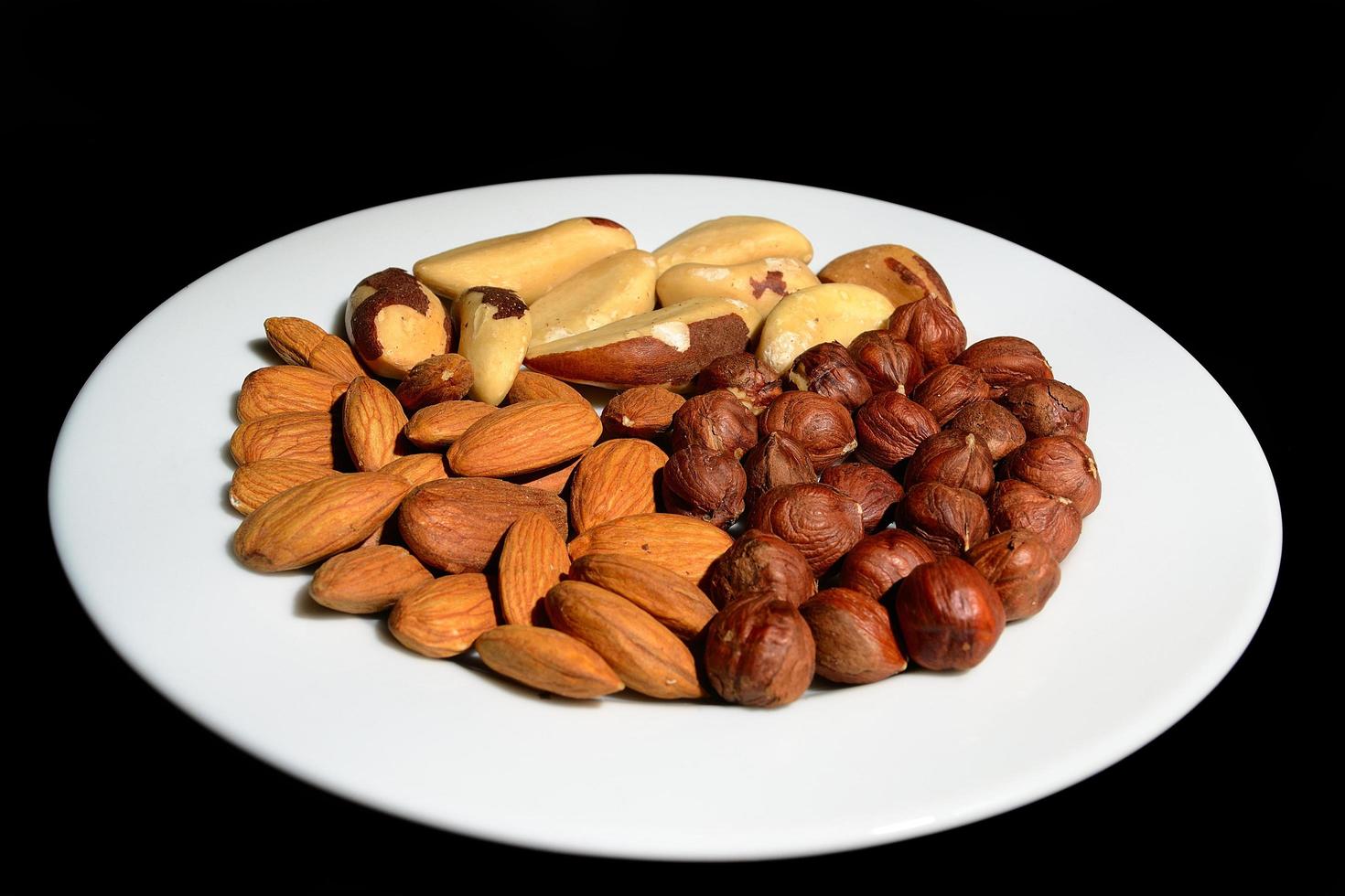 nuts on a white plate photo