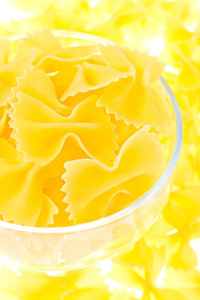 Yellow noodles in a glass photo