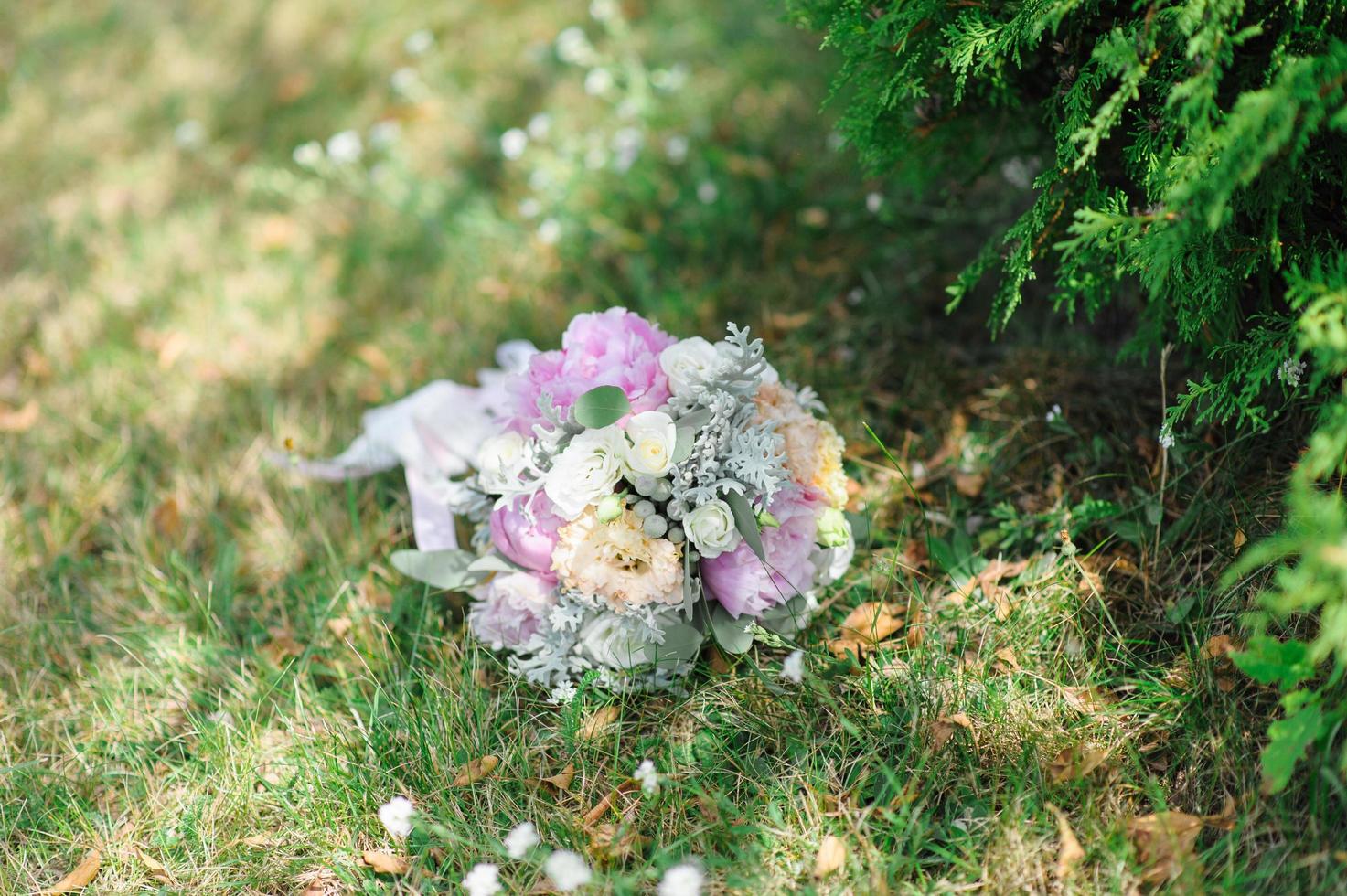 wedding bouquet on the grass photo