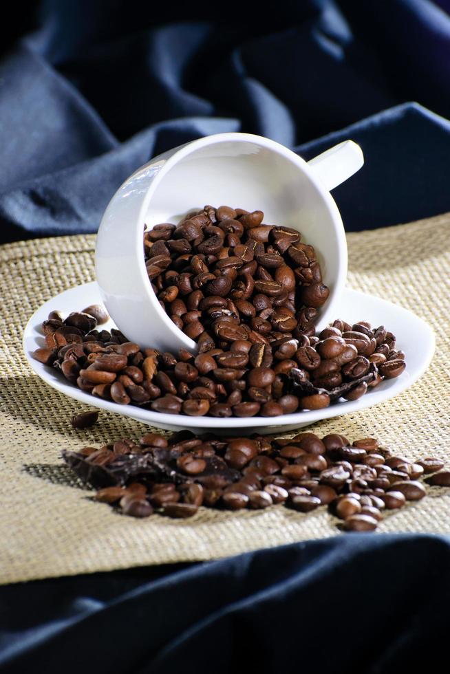 The inverted cup with coffee beans photo