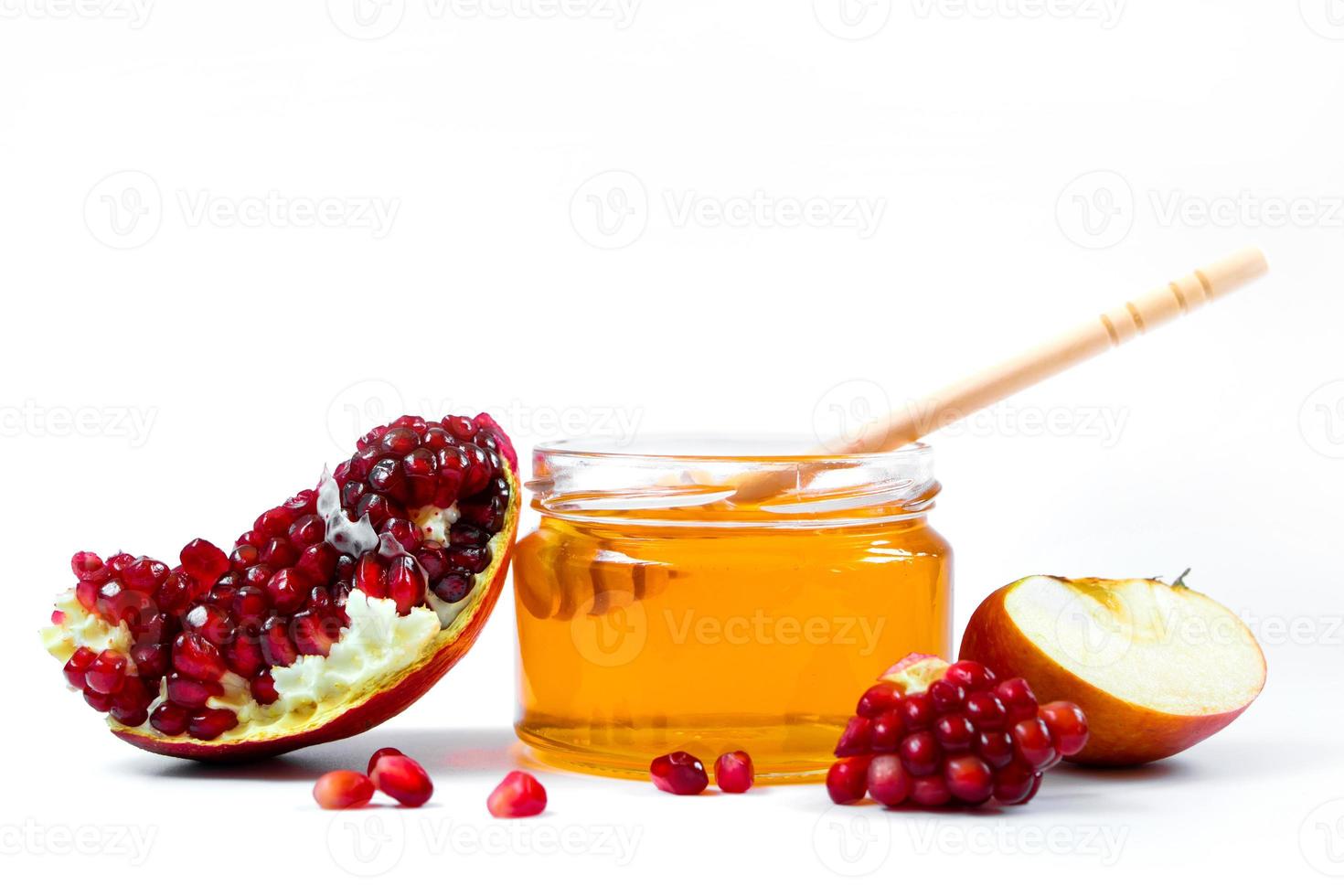 Rosh Hashanakh Jewish holiday. Apples, pomegranates and honey isolated on white background. Traditional Judaism photo
