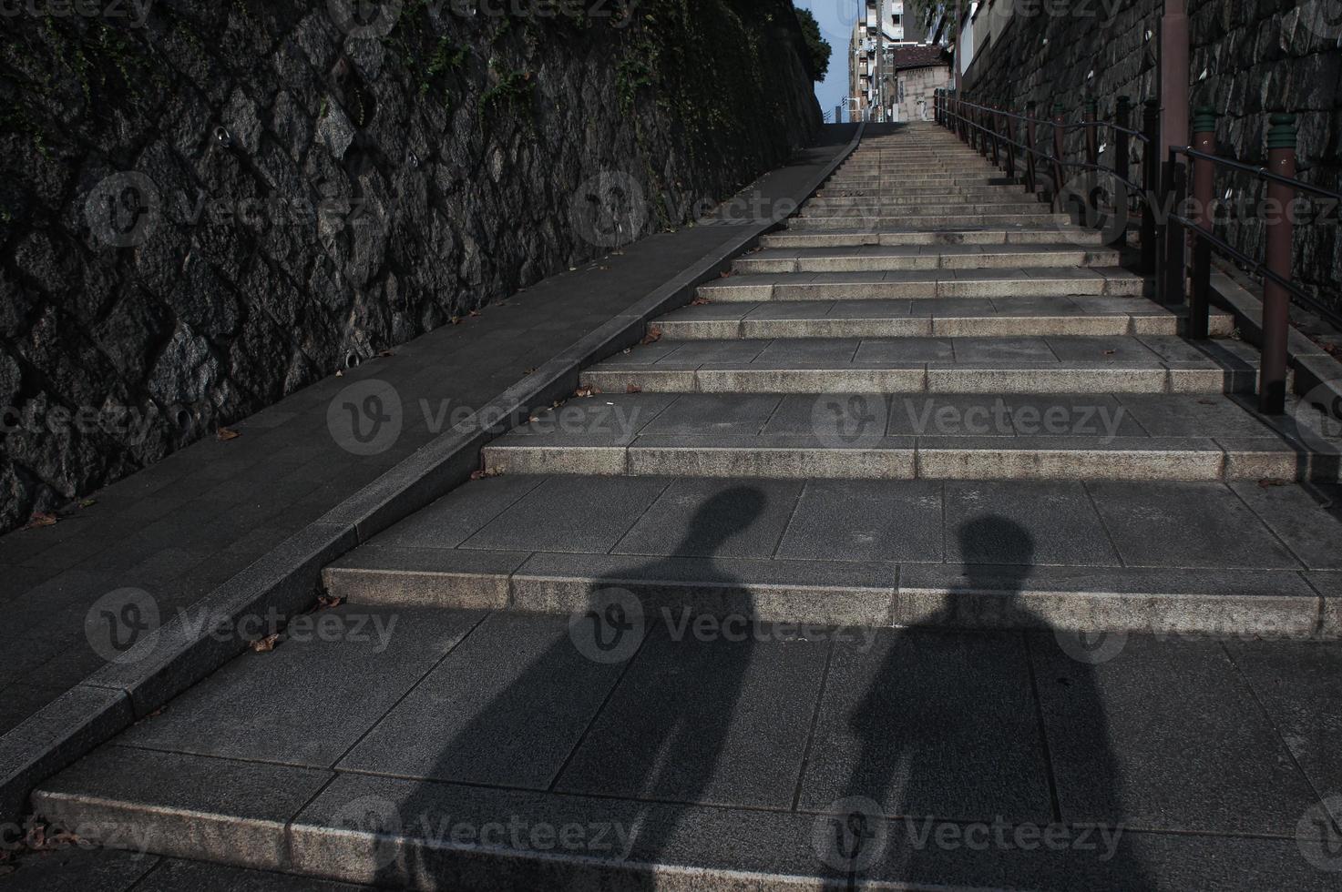 I can see the shadows of the two brothers on the stairs photo