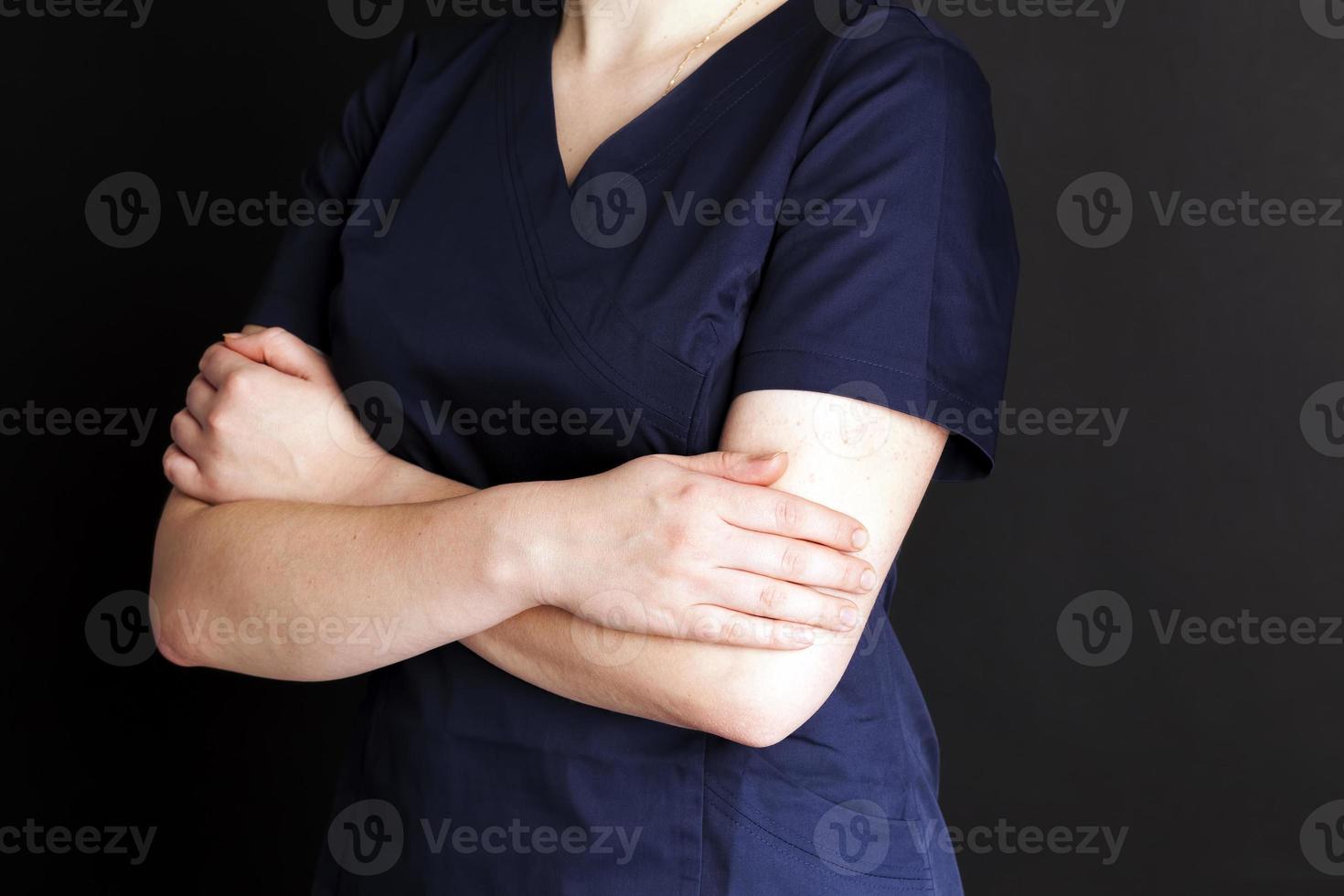 a girl in blue medical clothing, a close up photo