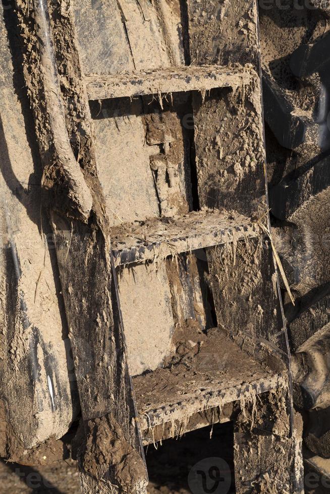 dirty ladder tractor photo