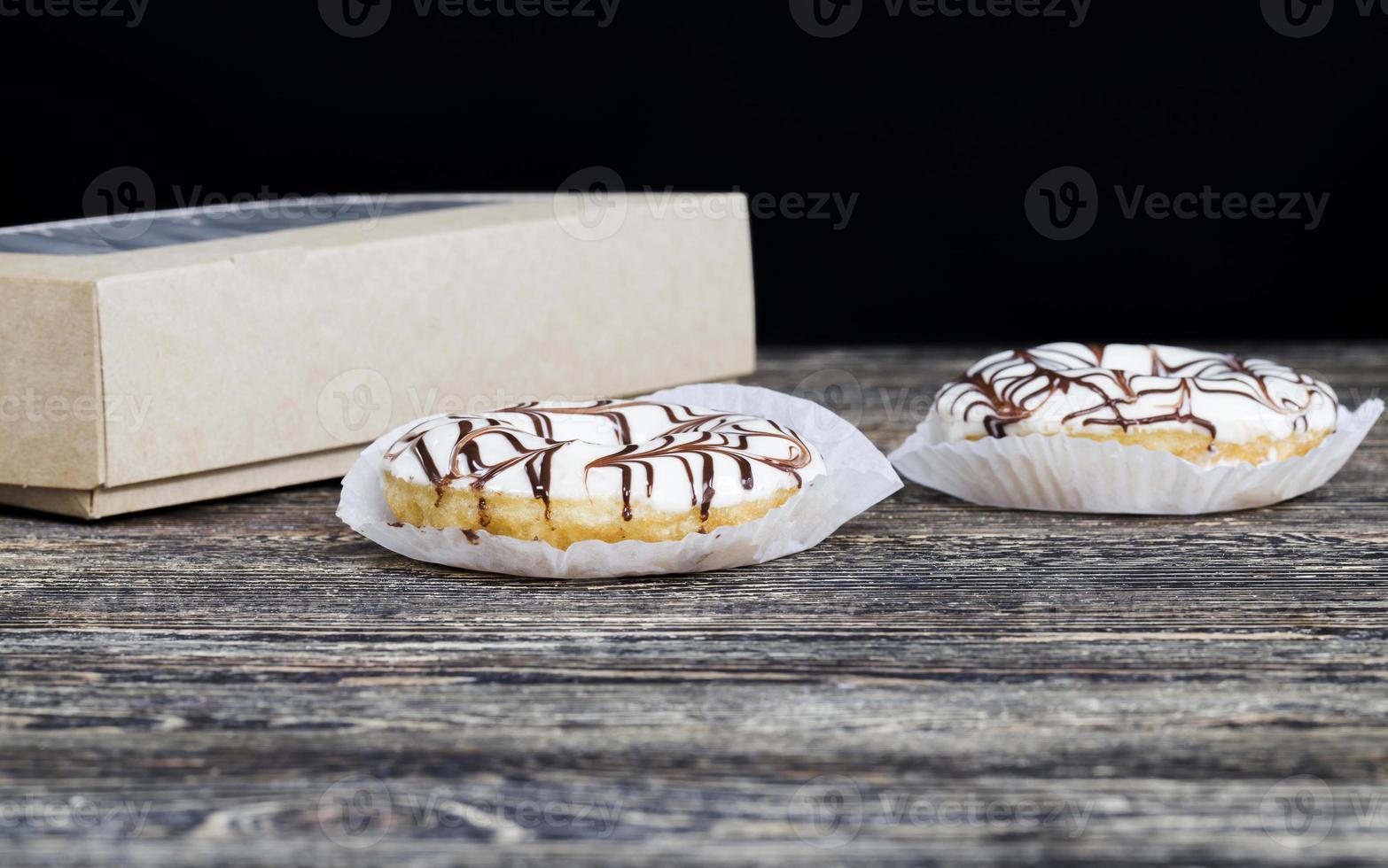 delicious doughnuts with chocolate covered filling, close up photo