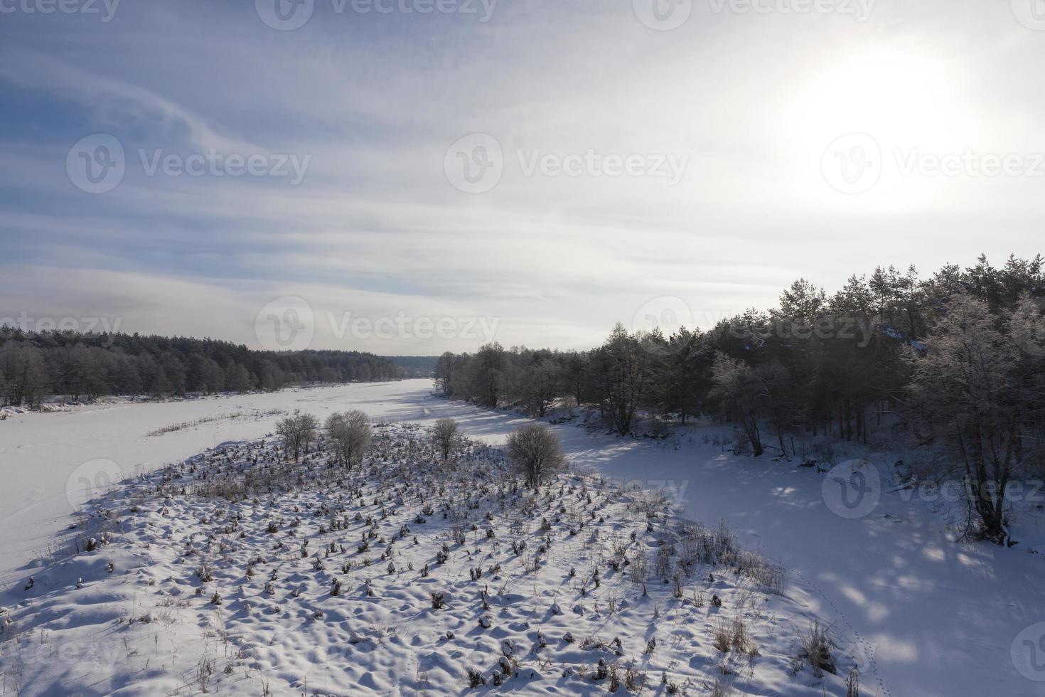 river covered with ice and snow photo