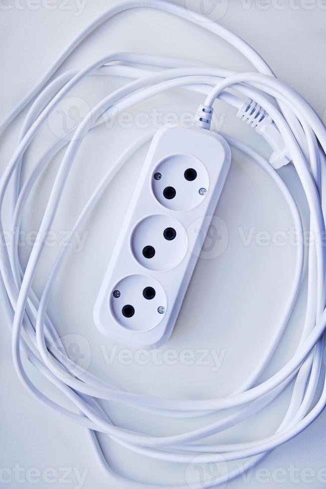 White electric extension cord, great design for any purposes. White background. photo