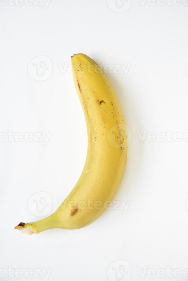 Ripe yellow banana on a white background. A bunch of fresh bananas. Sweet bananas for breakfast. photo