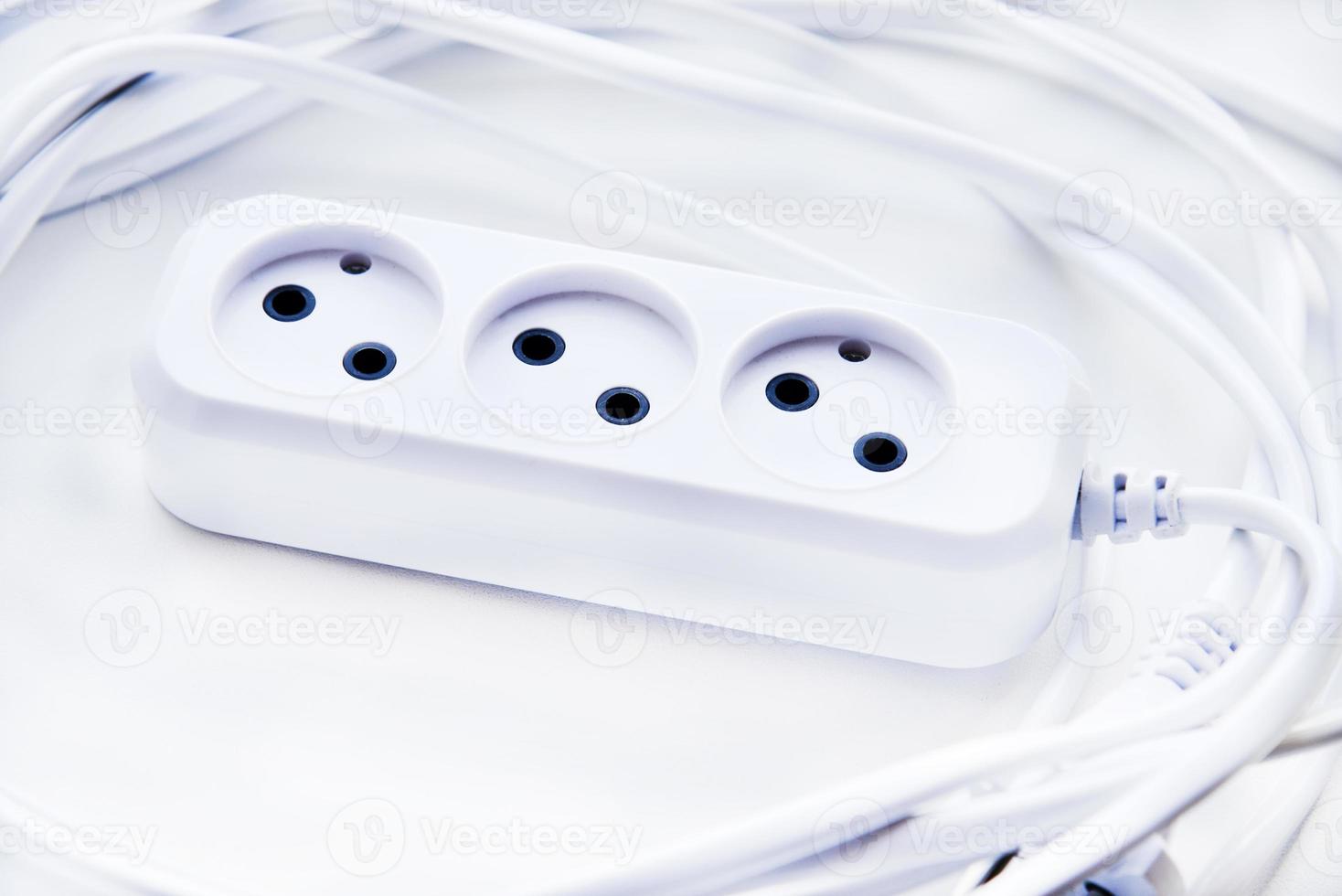 White electric extension cord, great design for any purposes. White background. photo