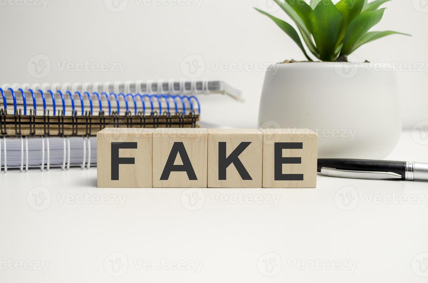 Fake concept. Wooden blocks with text. Copy space photo
