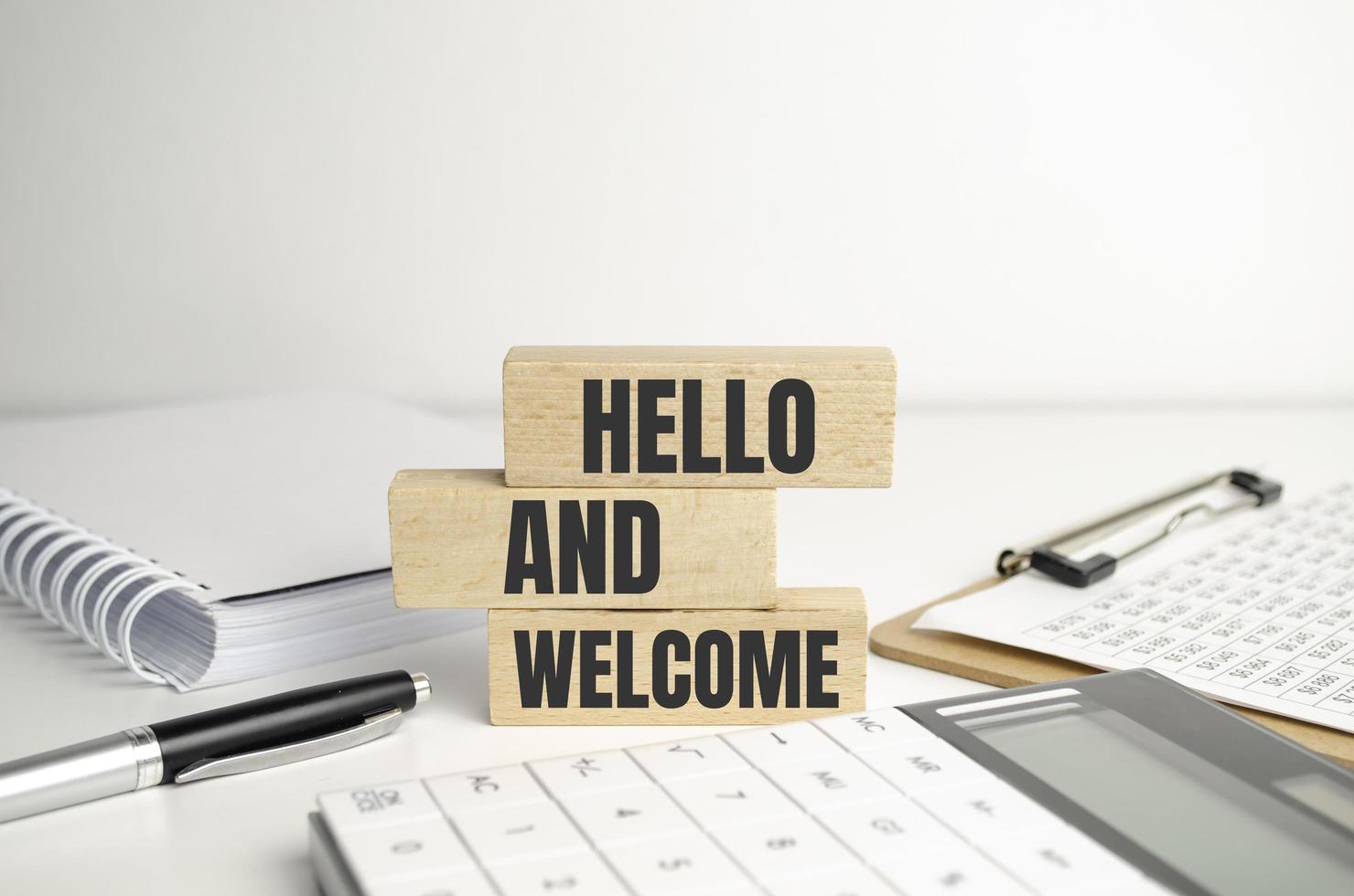 Hello and welcome symbol. Concept words Hello and welcome on wooden blocks photo