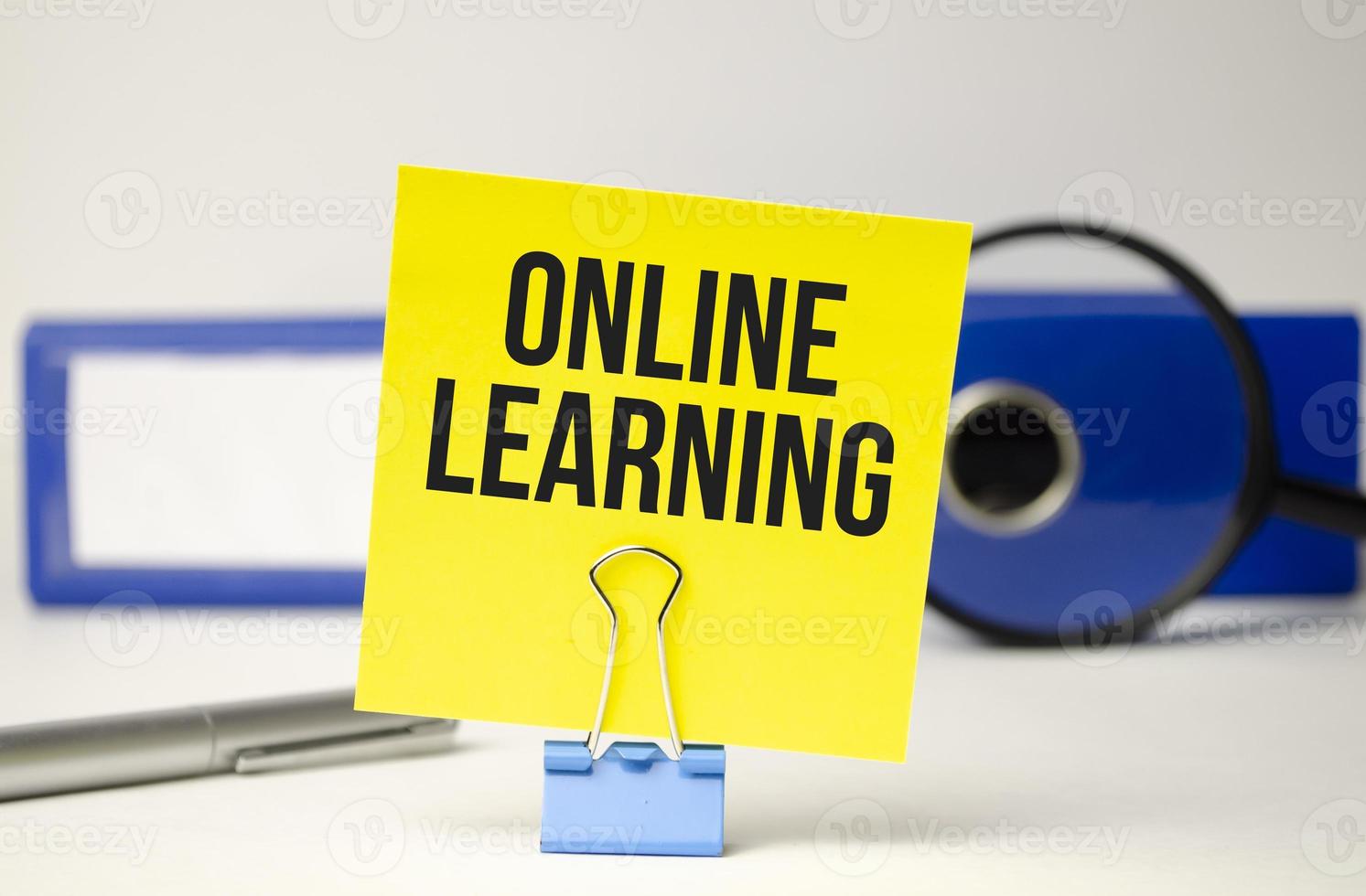 online learning text on yellow sticker and file folder photo