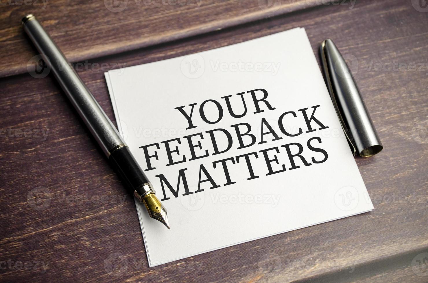 Your feedback matters words on sticker and pen photo