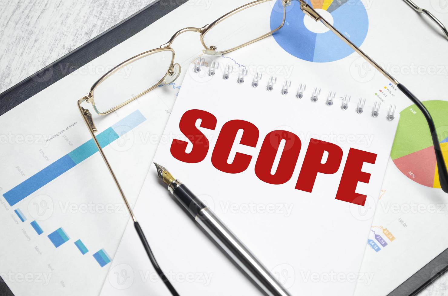 scope word on notepad with glasses and chart 9690709 Stock Photo at