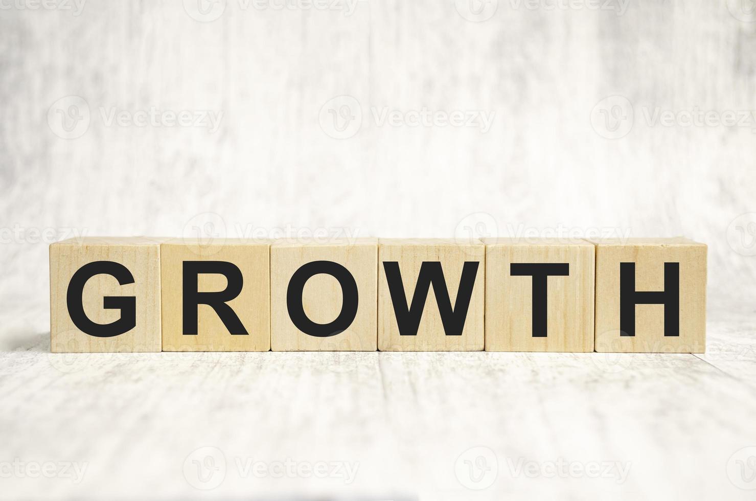 growth word on wooden blocks and white background photo