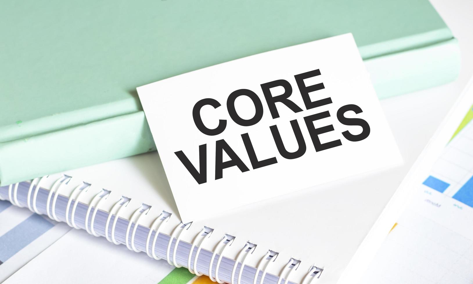 Core Values words on notepad and charts photo