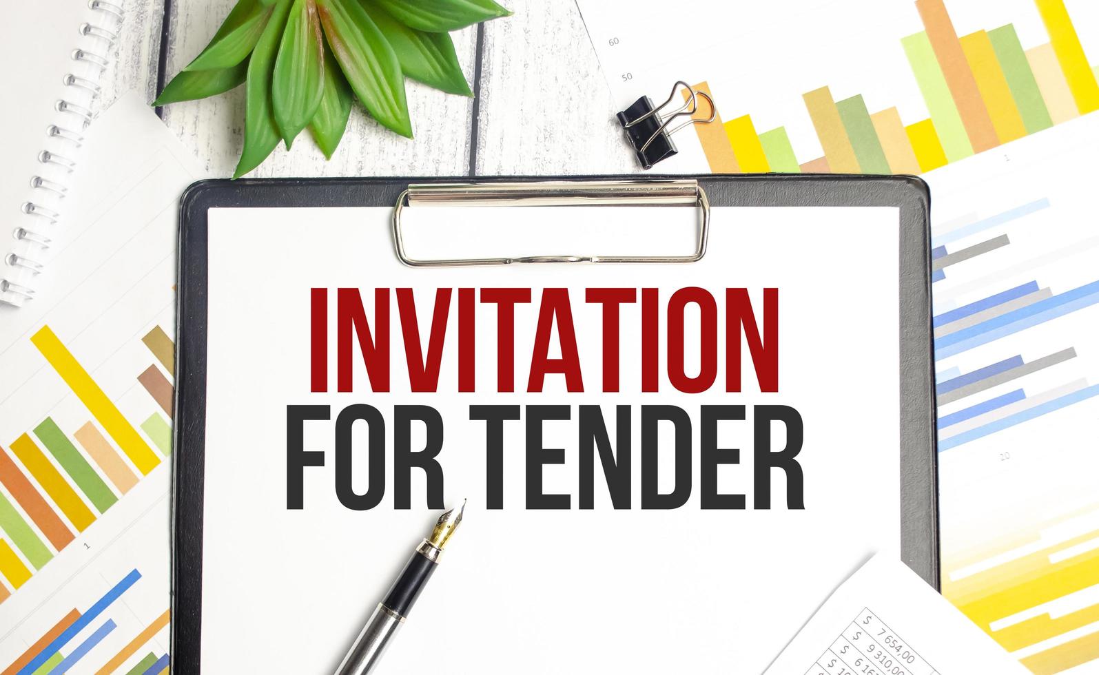 Text INVITATION FOR TENDER concept on wooden background photo