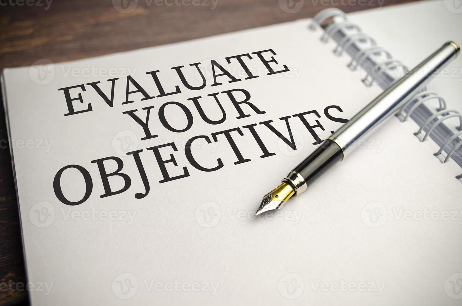 Wooden blocks with words EVALUATE YOUR OBJECTIVES photo
