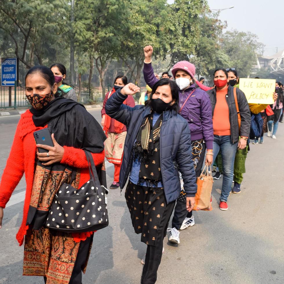 New Delhi, India December 25 2021 - Delhi Contractual Guest Teachers with posters, flags and graffitis protesting against Delhi AAP Government for making policy, Delhi Guest Teachers protesting photo