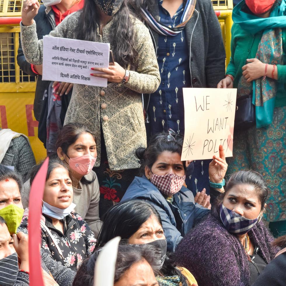 New Delhi, India December 25 2021 - Delhi Contractual Guest Teachers with posters, flags and graffitis protesting against Delhi AAP Government for making policy, Delhi Guest Teachers protesting photo