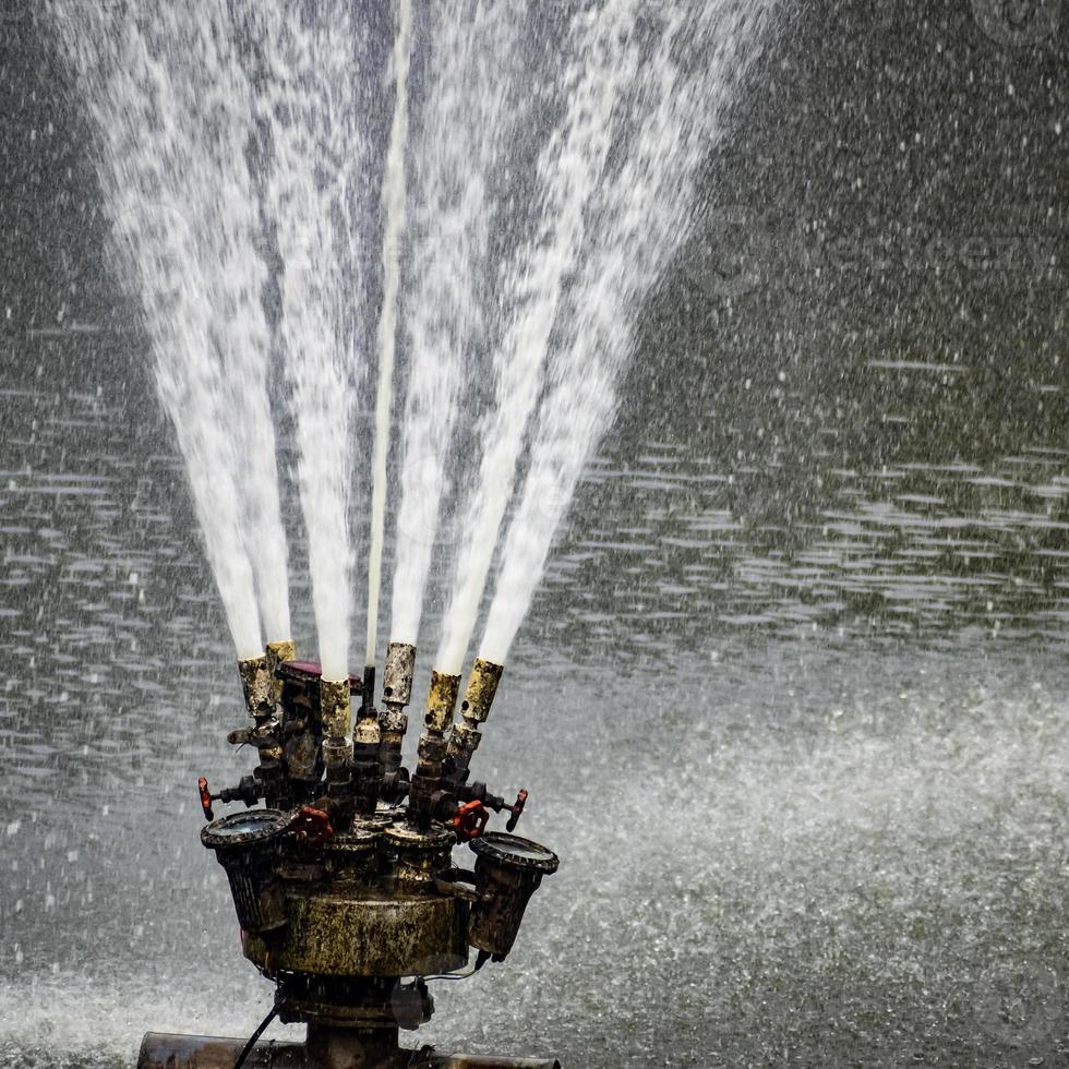 Fountain in the complex of Lodhi Garden in Delhi India, working fountain in the Lodhi Garden complex, water in the fountain, fountain in the Lodhi Garden park during morning time photo