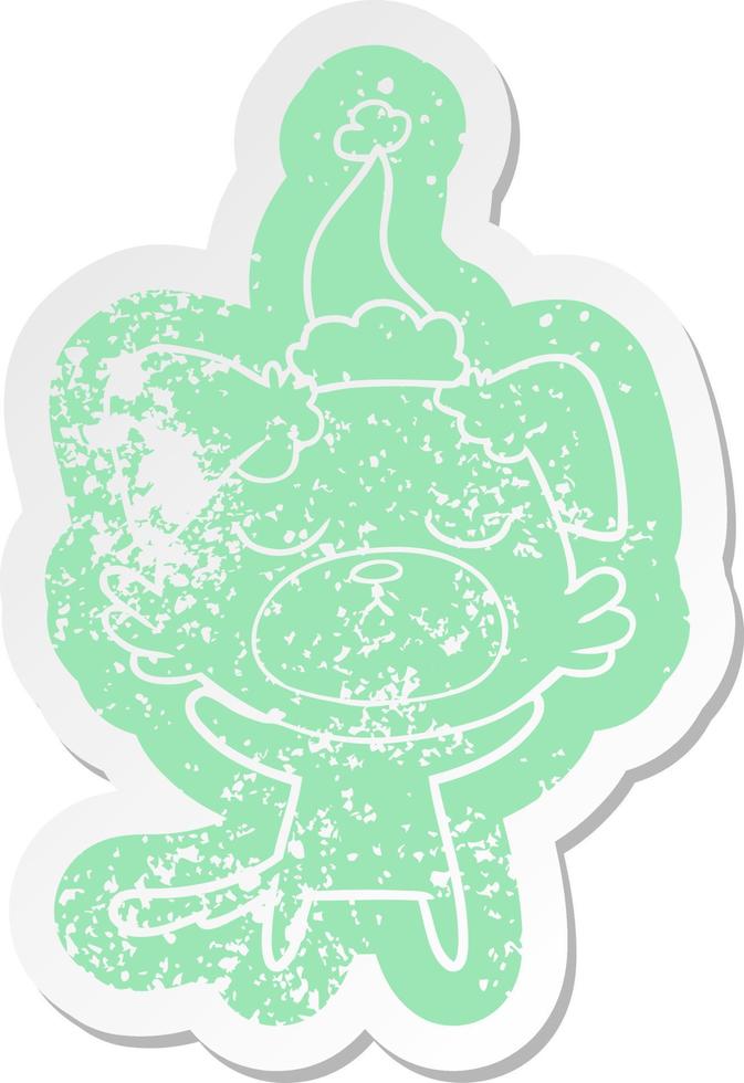 cute cartoon distressed sticker of a dog wearing santa hat vector