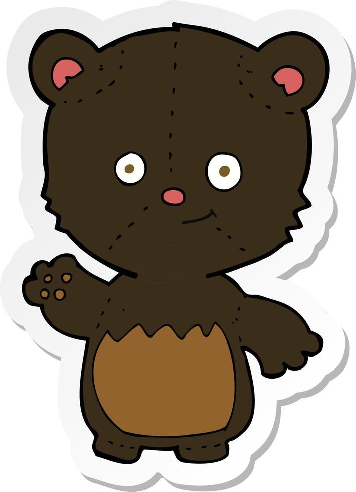 sticker of a cartoon little black bear waving vector