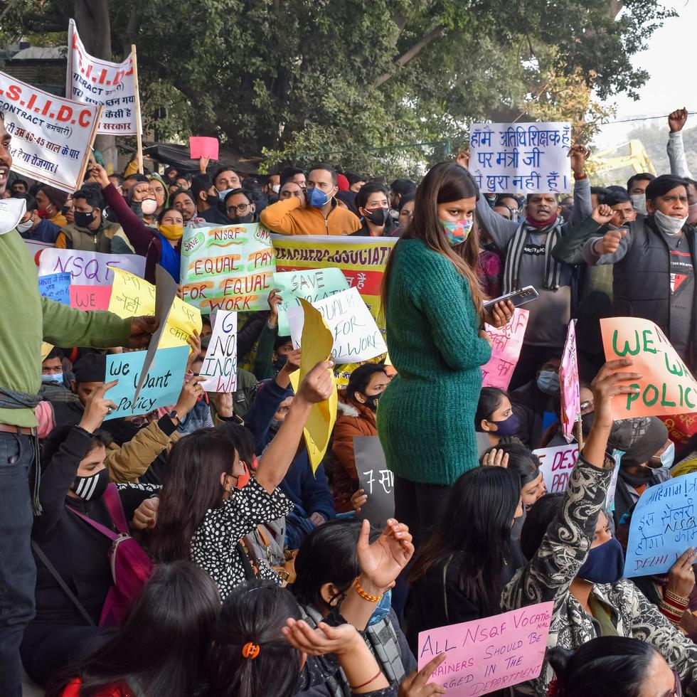 New Delhi, India December 25 2021 - Delhi Contractual Guest Teachers with posters, flags and graffitis protesting against Delhi AAP Government for making policy, Delhi Guest Teachers protesting photo