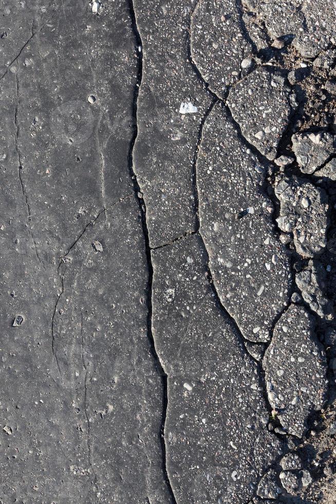 viejo asfalto dañado foto