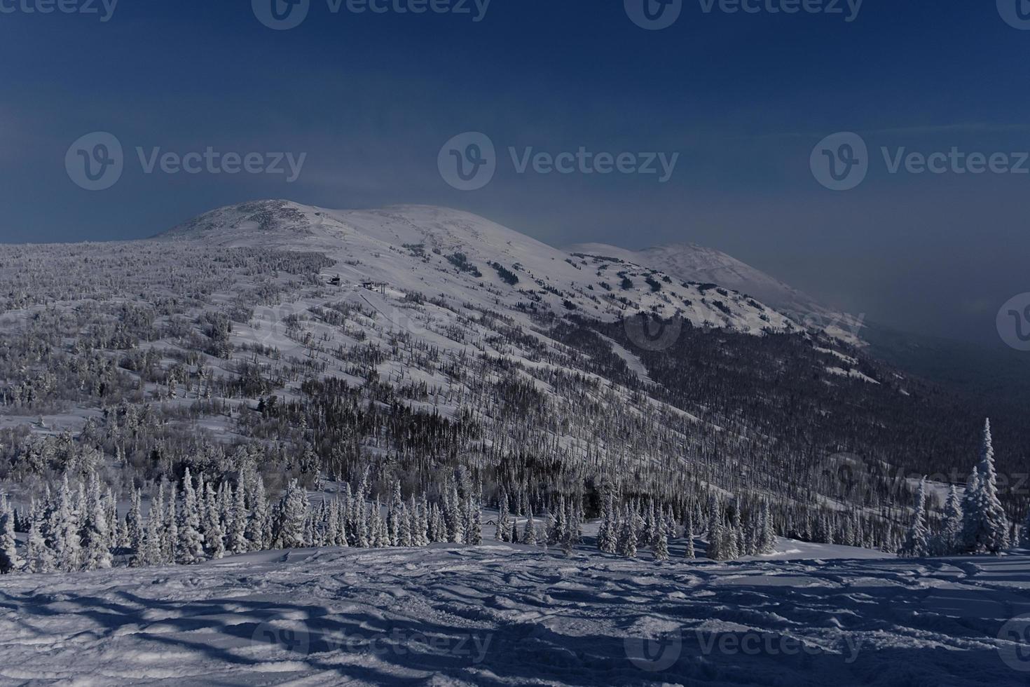 sunny winter morning in the mountains of sheregesh on the ski track photo